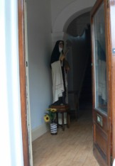 Front door of monastery with statue of St. Teresa