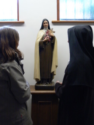 Aspirant with our Extern Sister before a statue of St. Therese