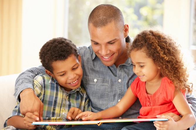 Father reading to his children