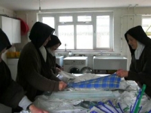 Folding linen in the laundry