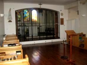 View from choir through grating onto chapel sanctuary